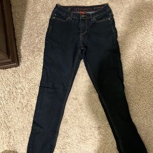 Perfect condition. No holes, no rips. Just to long for me. Dark denim.